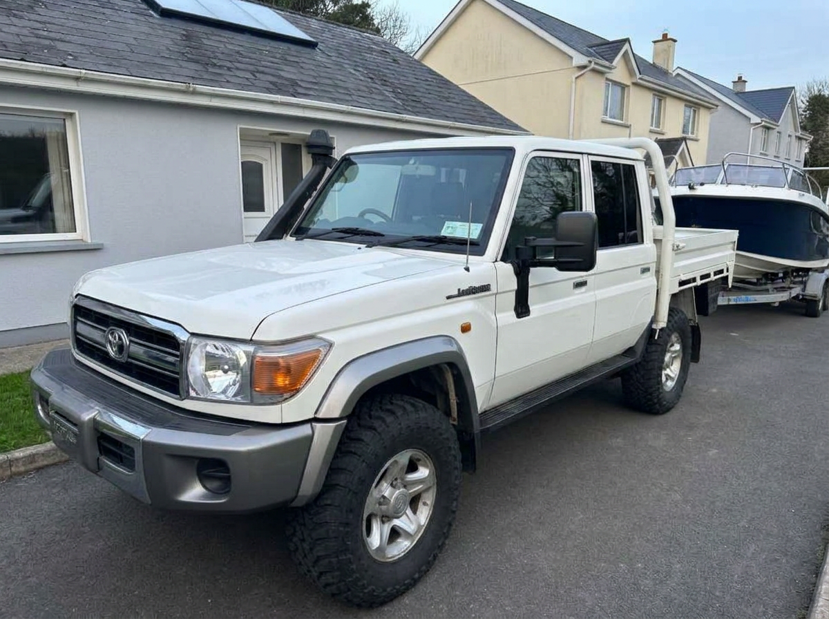 White Toyota Land Cruiser pickup with freshly tinted cab windows