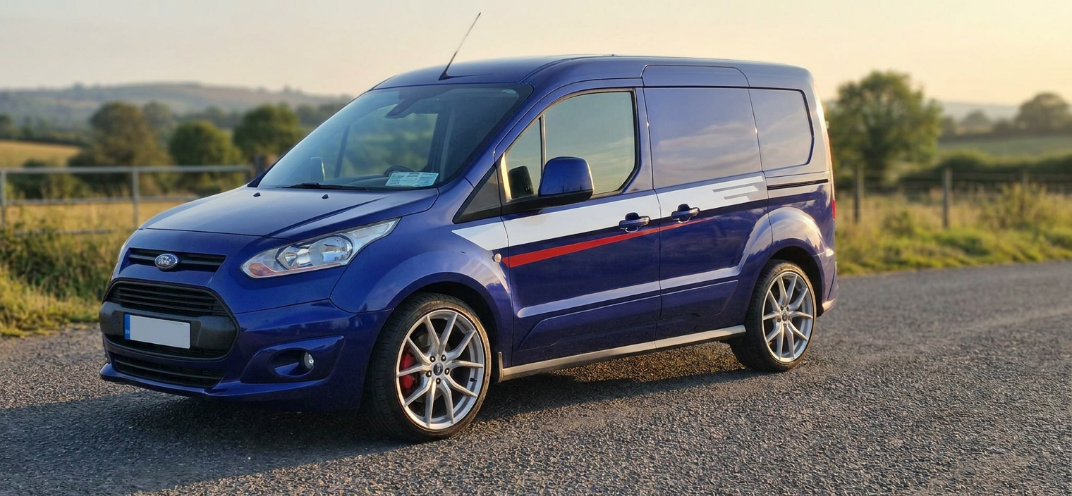 Blue Ford Transit Connect Sport with tinted windows parked on a country road at sunset