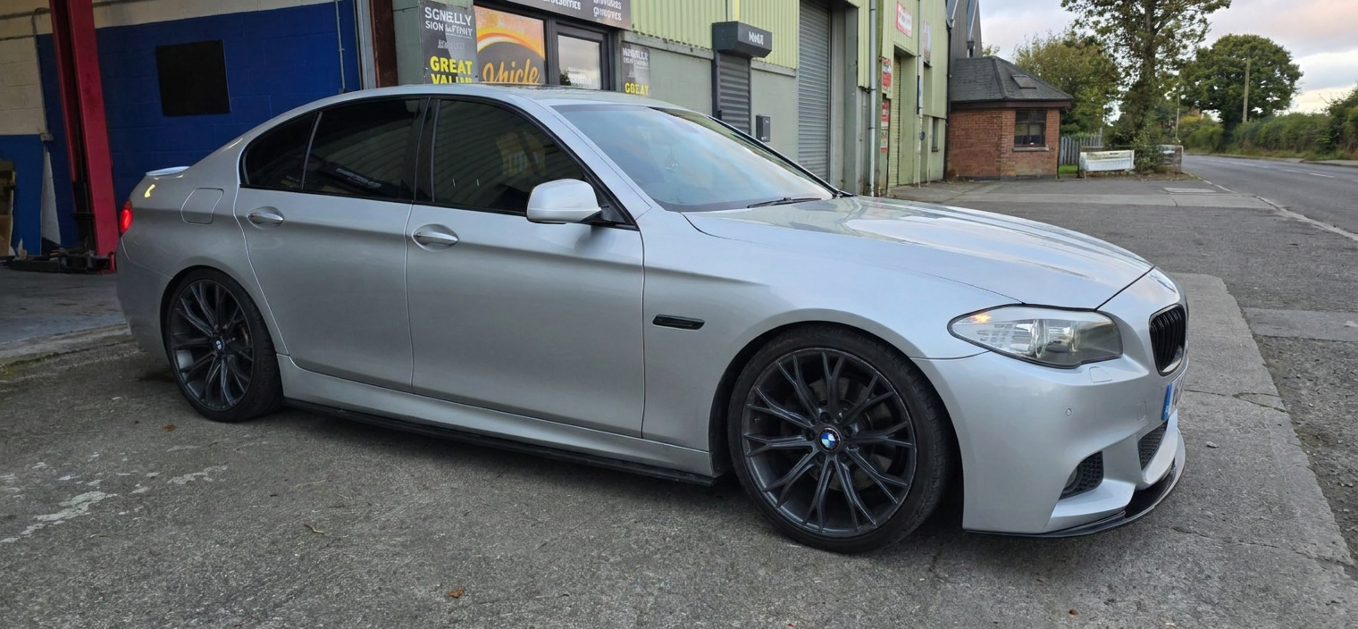 The same silver BMW saloon after its windows were tinted