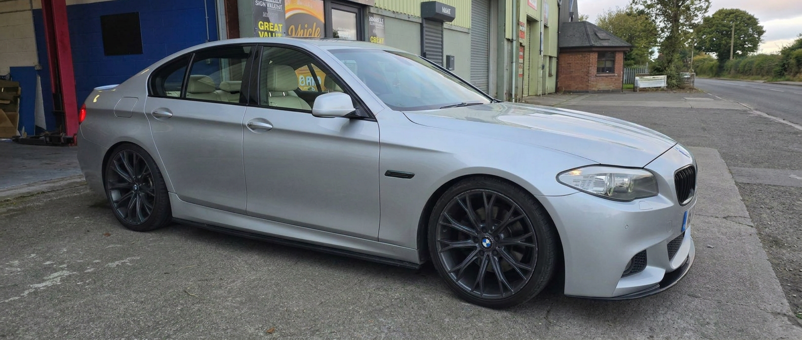 Silver BMW saloon with standard factory glass before tinting